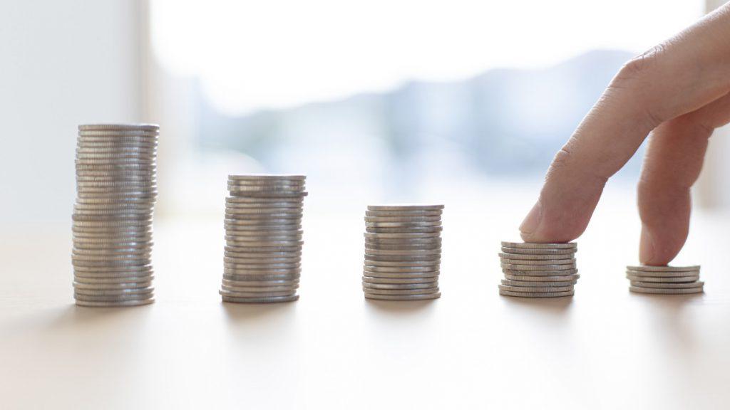 placeholder image of stacks of coins for article on wages and inflation